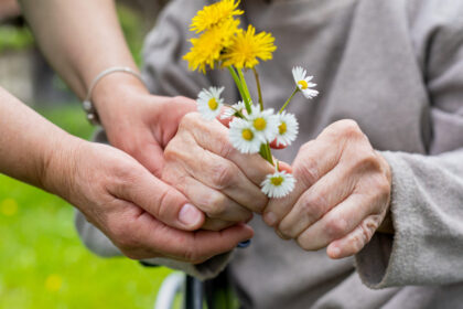 Hands holding flowers